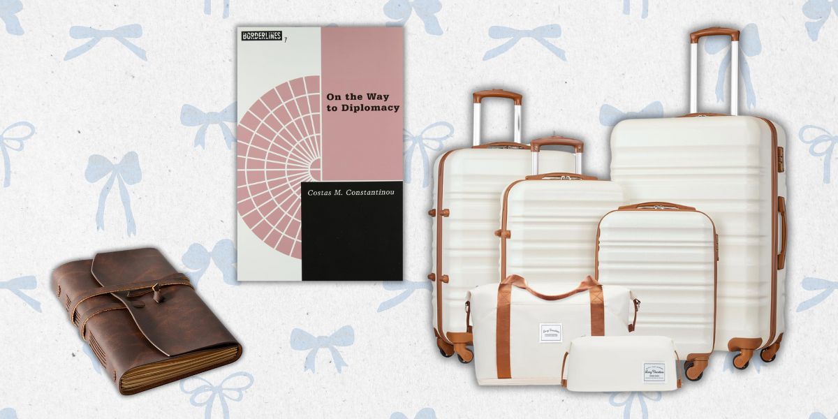 Monogramed leather journal, a Luggage Set, and book about diplomacy