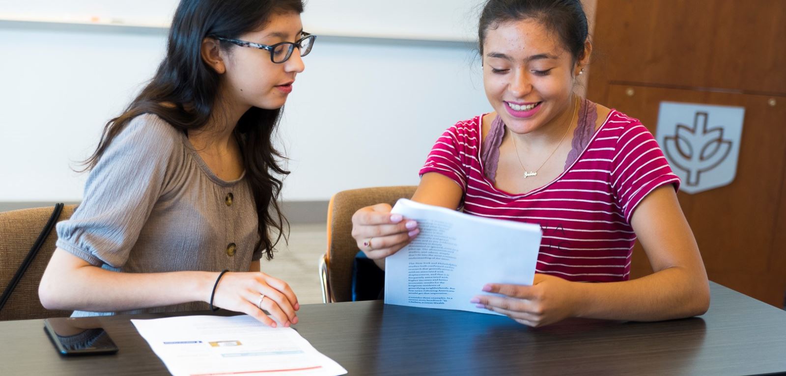 students reviewing college essays